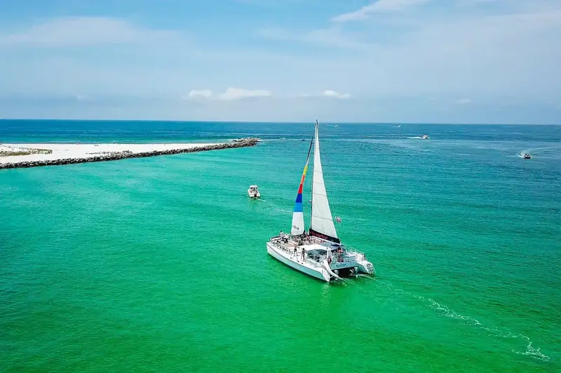 Sailing catamaran on turquoise water